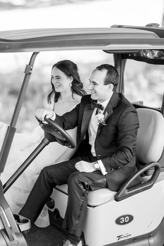 Couple Riding Golf Cart

